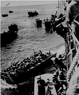 U.S. troops go over the side of a Coast Guard manned combat transport 